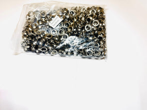Bag of metal eyelets on a white background