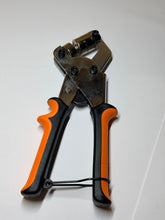 Pliers with black and orange handles on a white background
