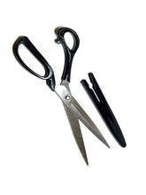 Professional tailor scissors close-up showing razor-sharp blades for effortless fabric cutting.