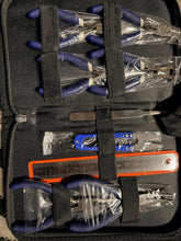 Set of tools in a black case with blue handles